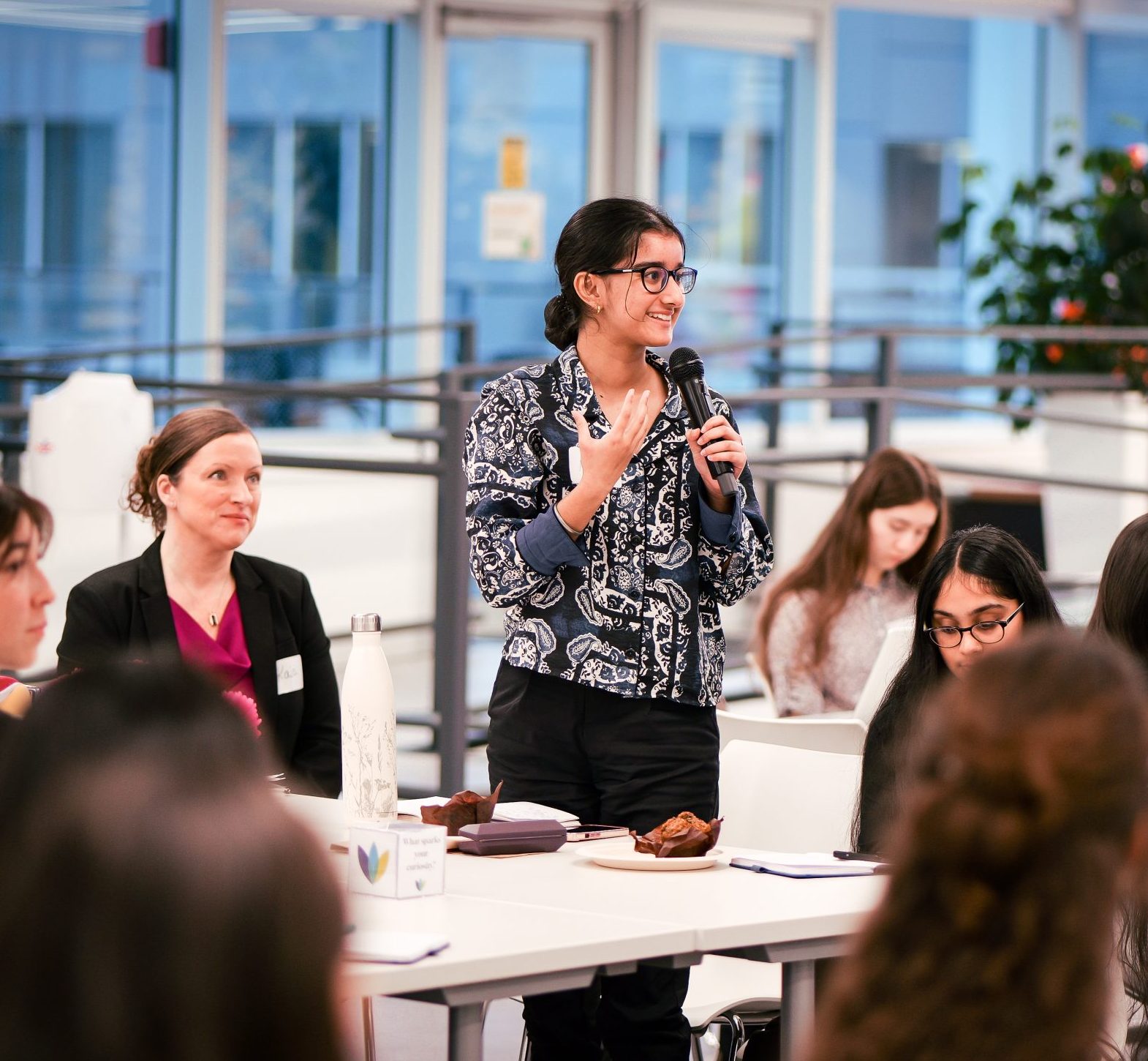 girl speaking up during an event