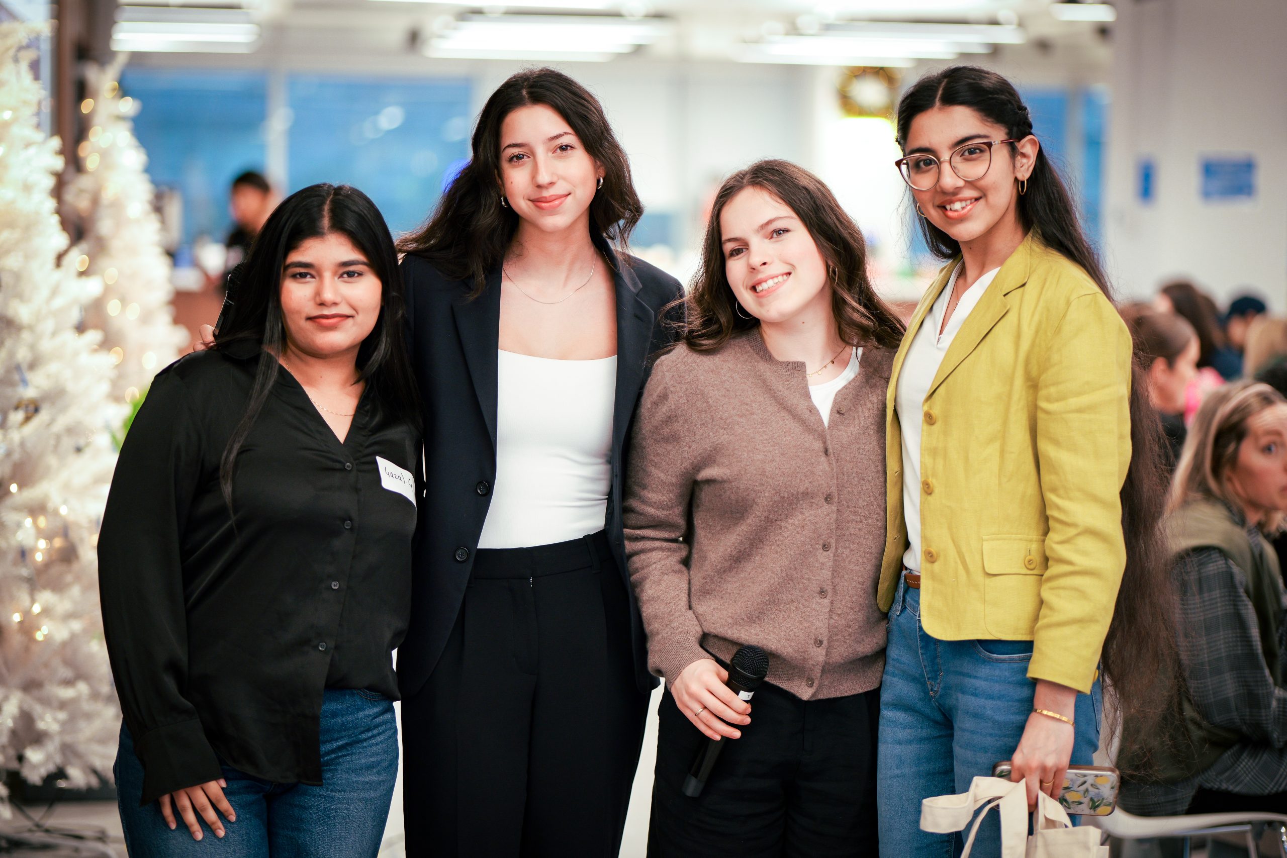 group of formally dressed girls being taken a photo